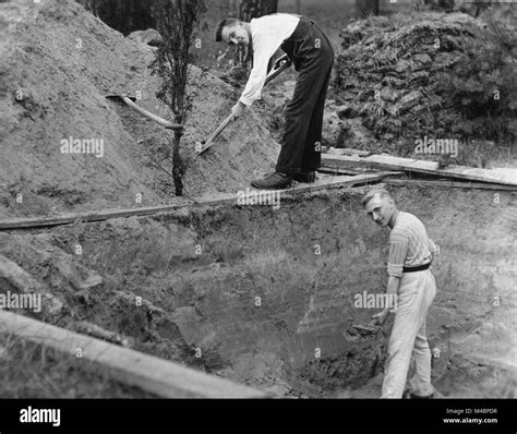 Two Men Digging A Hole1940sexact Place Unknowngermany Stock Photo