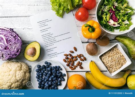 Balanced Diet Plan With Fresh Vegetables And Fruits On The Table Stock