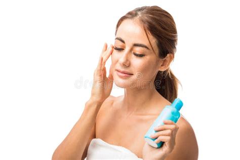 Female Model Using Skincare Product In Studio Stock Image Image Of