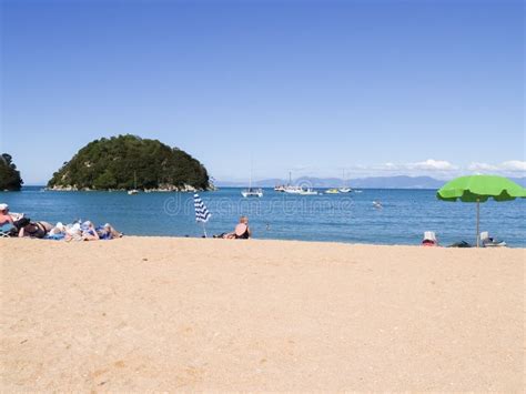 People Enjoying Summer At Golden Bay Beach Sunbathing And Swimming Editorial Stock Image