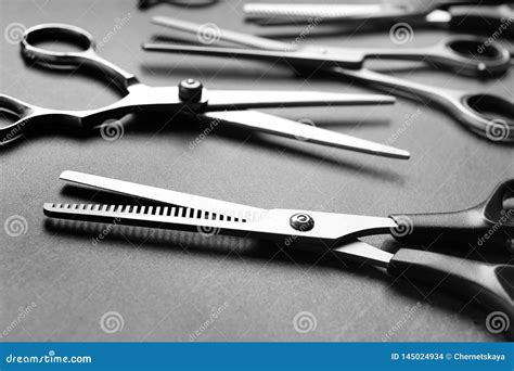Many Scissors On Grey Background Hairdresser Tools Stock Photo Image