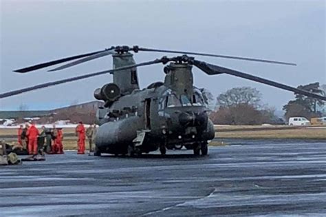 uk weather forecast latest flood alerts issued across the uk as chinook military helicopter