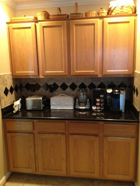 The upper cabinets are painted classic. Black Granite Countertops with Oak Cabinets | Granite ...