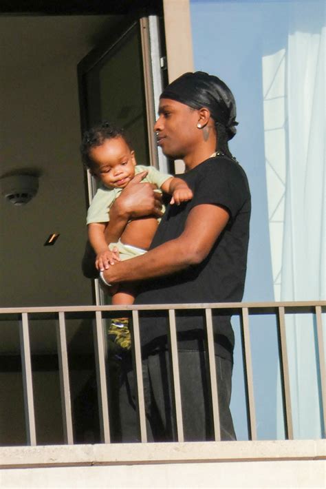 Asap Rocky Holds His Son On A Balcony At Paris Hotel Photos