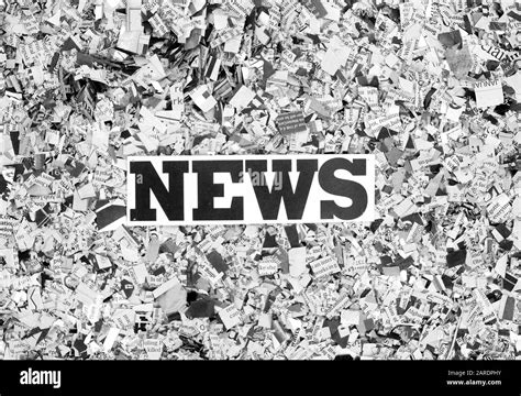 Newspaper Confetti From Above With The Word News Background Stock Photo