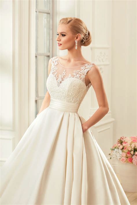 This modern satin ball gown wedding dress featuring huron mikado, a romantic scoop neck, and a low back, has us swooning! Chapel Train Satin Backless Wedding Dress - My Wedding Ideas