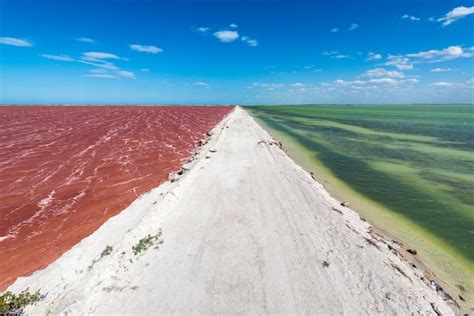 Premium Photo Dirt Road And Colorful Water