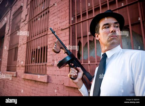 Gangster With Tommy Gun On Look Out Outside Building Stock Photo Alamy