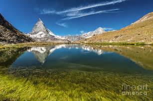 Matterhorn Mountain Behind A Beautiful Lake With Grass Photograph By