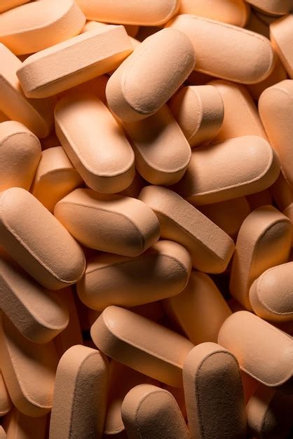 Premium Photo Orange Pills Spread Out