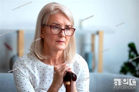 Sad Lonely Thoughtful Pensive Old Mature Woman Hold Cane Stick Sit