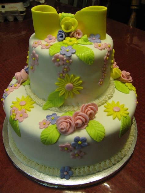 Stenciled flowers and fruity filling. - Springtime wedding cake. chocolate on top. yellow on bottom. Strawberry filling. Decorated ...