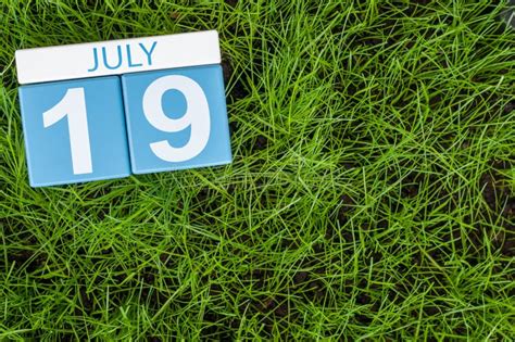 July 19th Image Of July 19 Wooden Color Calendar On Greengrass Lawn