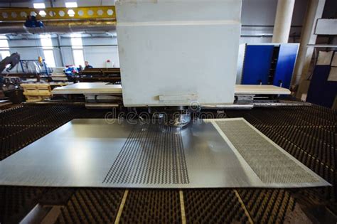 Cnc Punching And Nibbling Machine And Perforated Steel Sheet Close Up