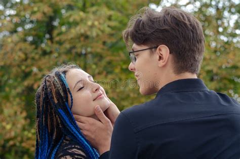 A Manand X27s Hand Adjusts The Blue Braids In The Womanand X27s Hair Long B Stock Image Image