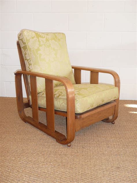 A small armchair that is easy to move is perfect for offering some extra seating when you have guests over. Heals Recliner Easy Chair - Antiques Atlas