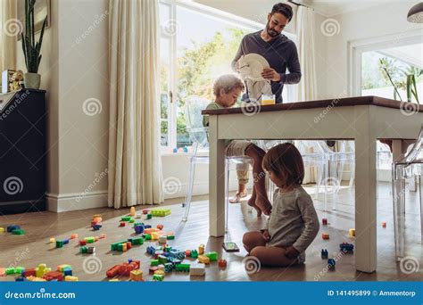 Father Babysitting His Kids At Home Stock Image Image Of Education