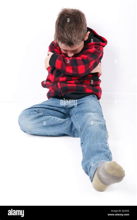 Sad Young Boy Sit On White Background Stock Photo Alamy