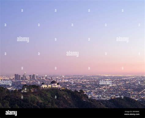An Overview Of Griffith Observatory And Downtown Los Angeles At Dusk
