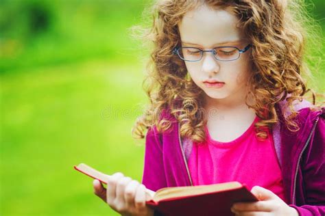 Little Girl Eyeglasses Reading Book Autumn Park Stock Photos Free