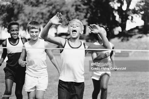 Children Crossing Finish Line High Res Stock Photo Getty Images