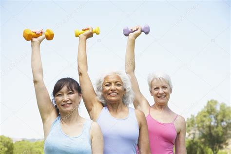 Multi Ethnic Senior Women Lifting Weights — Stock Photo © Bst2012 23308308