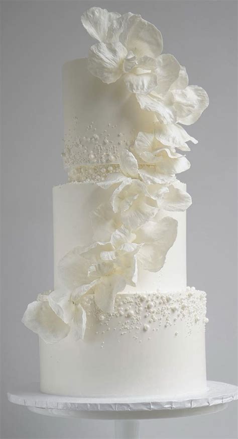 40 beautiful wedding cake trends 2023 pearl cake with cascading floral