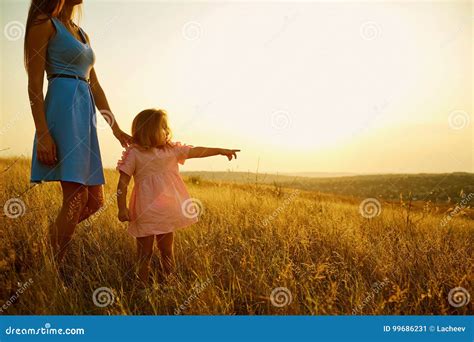 Mother And Daughter In Nature At Sunset Stock Image Image Of Field