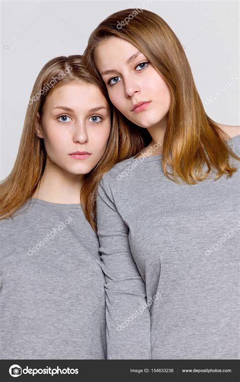 Two Twin Sisters Snuggled Portrait — Stock Photo © Andre2013 154633238