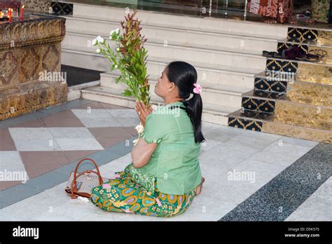 Woman Praying At Shwedagon Pagoda Yangon Rangoon Myanmar Burma