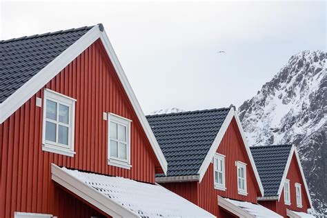 Detail Of Three Houses And Snow Capped Mountain Svolvaer Lofoten