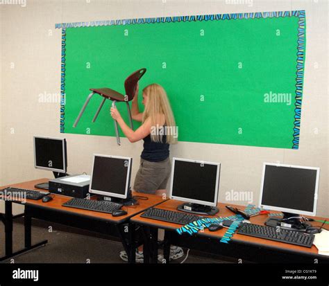 Third Grade Teacher Bridgette Jakubowicz Moves A Chair Out Of The Way