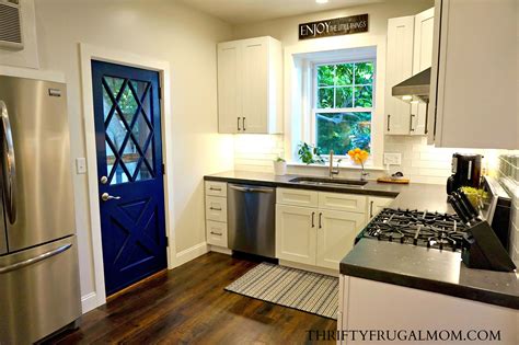 In determining how much money to spend on a kitchen remodel, many experts recommend using a percentage of your home's valuation. Budget Friendly Kitchen Remodel- White and Blue Kitchen compressor - Thrifty Frugal Mom