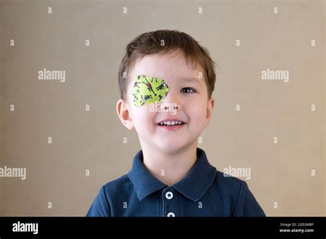 Little Boy With Okluder On The Eye Stock Photo Alamy