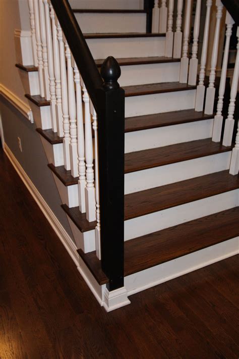 Jacobean Stained Floor And Stair Treads With White Spindles And Black