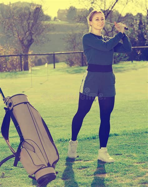 Female Golf Player Looks Successfully After The Golf Game Stock Image