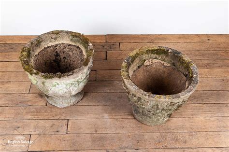 Pair Of Weathered Composite Stone Urns