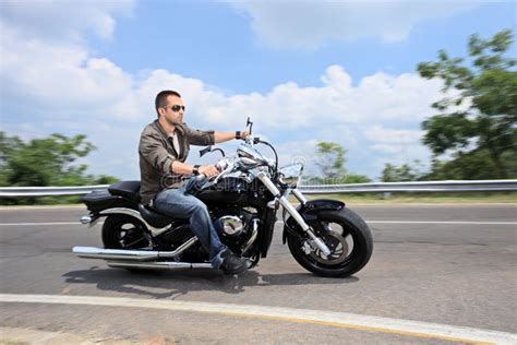 Young Man Riding A Motorcycle On An Open Road Stock Image Image Of