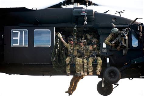 Us Special Forces Soldiers Prepare To Fast Rope Out Of A Uh 60 Black