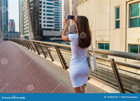 Happy Beautiful Tourist Woman In Fashionable Summer White Dress And