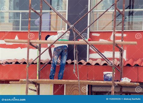 A Man Painting Wall On The Building Stock Image Image Of Hand