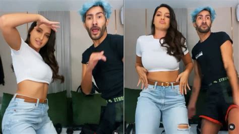 Nora Fatehi Does A Sensuous Booty Shake In White Crop Top And Denim Jeans With A Handsome Man See