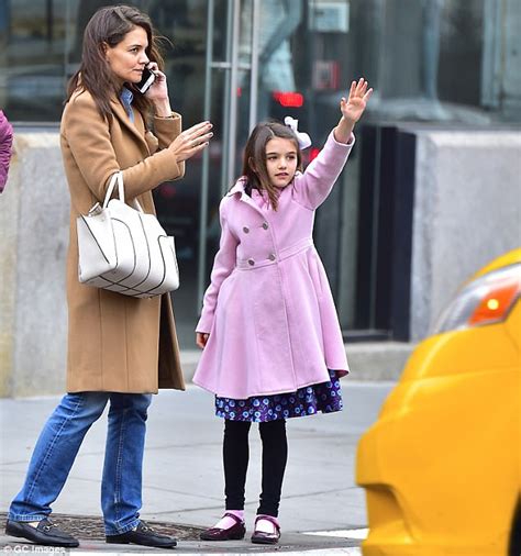 She biked around nyc with daughter suri before going on a date with her handsome beau emilio vitolo jr. Katie Holmes hails cab with Suri in coordinating coats ...