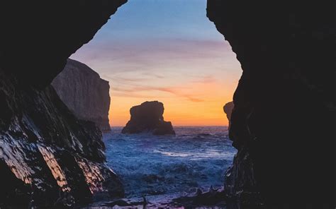 Download Wallpaper 1920x1200 Cave Rocks Sea Sunset Widescreen 1610