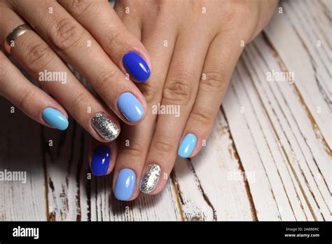 Beautiful Blue Manicure On A Beautiful Textural Background Stock Photo