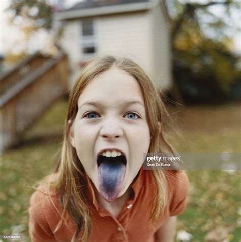 Girl Sticking Out Blue Tongue Bildbanksbilder Getty Images