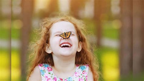 Download Happy Girl With Butterfly On Her Nose Picture