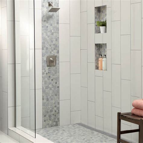 This transitional styled bathroom features ceramic tile walls and natural stone floors accented with glass and stone mosaic. Daltile Restore Bright White 4 in. x 16 in. Ceramic Wall ...