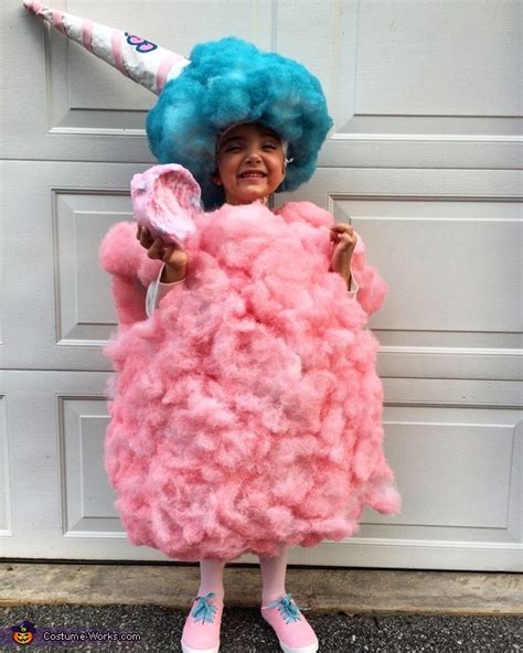 All you need is a pink body con dress, pink heels, pink faux fur, and a few board papers, and you can transform into this tempting sweet snack! Homemade Cotton Candy Costume - Photo 2/2