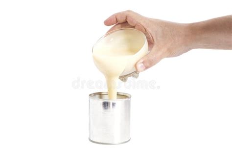 Man Hand Pouring Condensed Milk Into A Tin Can Stock Photo Image Of